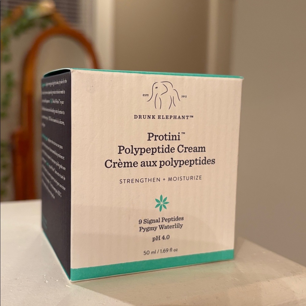 New in box and unused. Drunk Elephant Strengthening Cream in Cream and Teal Box